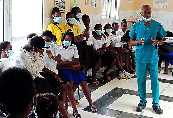 Doctor talking to women about the risks of cervical cancer in Equatorial Guinea