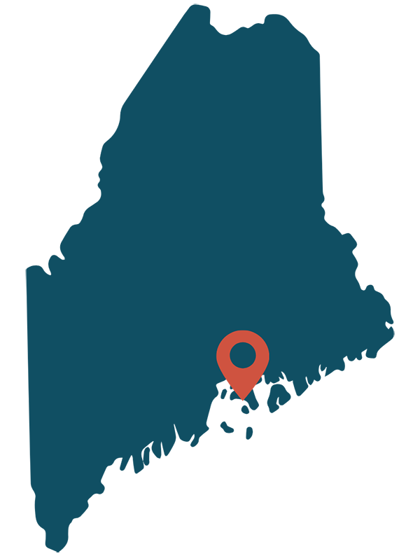 Blue map of Maine with a red pin showing where Deer Isle is.