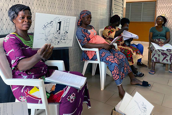 Health worker leading a group antenatal care session in Benin.