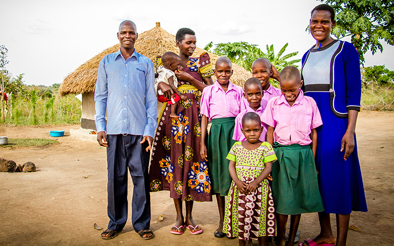 Family posing for photo in Uganda